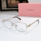 MiuMiu glasses with gold-tone frame and clear lenses, tortoise accents