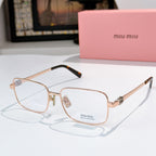 MiuMiu glasses with rose-gold frame and clear lenses, gold temples
