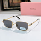 MiuMiu glasses with gold-tone frame and dark blue lenses, black temple tips
