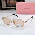 MiuMiu glasses with gold-tone frame and light lenses, black temple tips