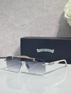 Chrome sunglasses with dark blue lenses and thin metal frame, with gold-tone temple accents.