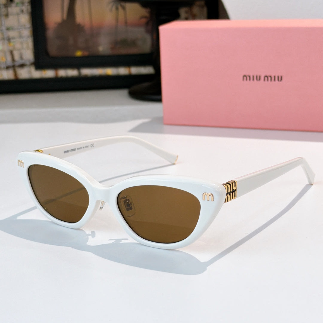 White cat-eye sunglasses with brown lenses and gold-tone temple logo accents