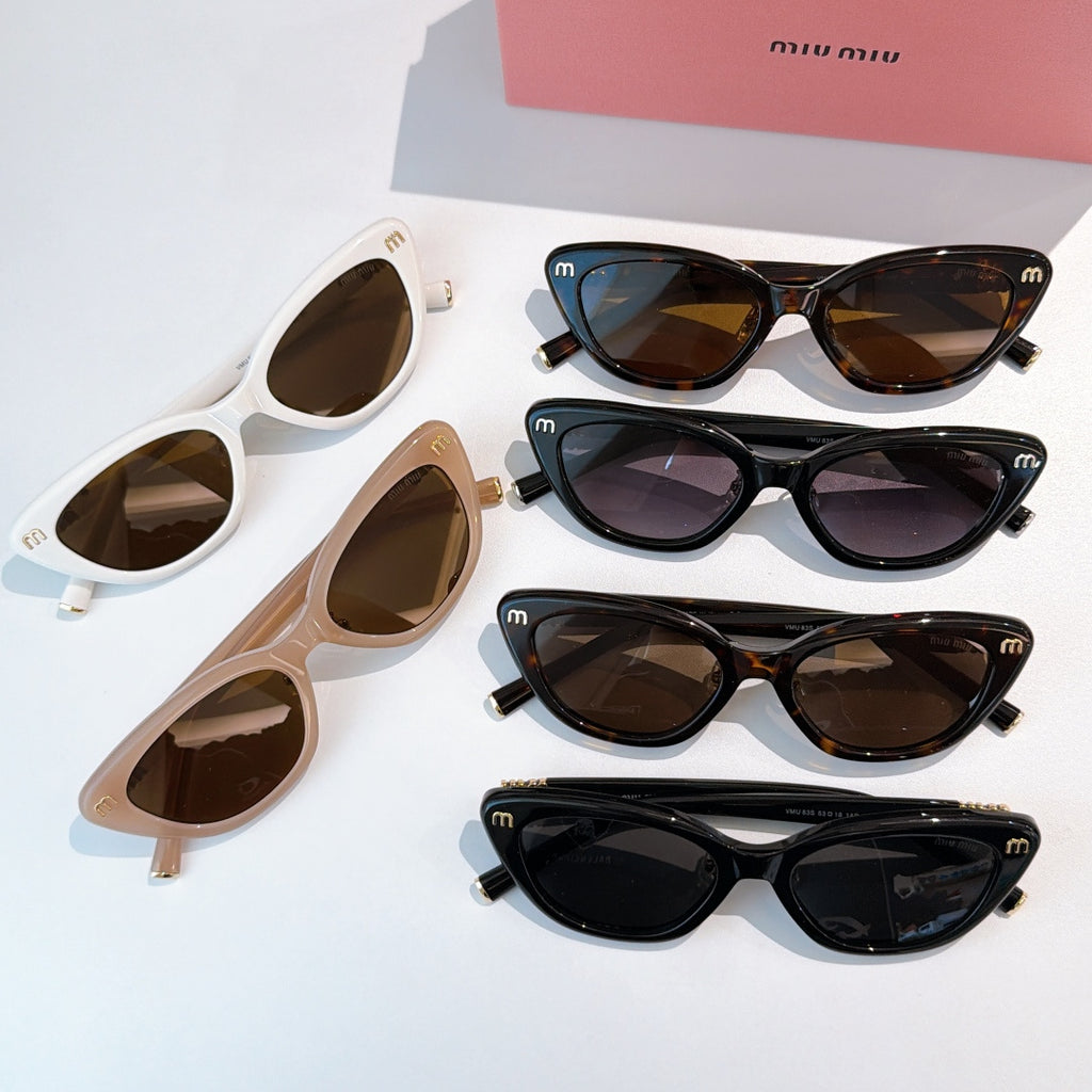 Assorted cat-eye sunglasses set in white, beige, and dark frames with tinted lenses