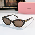 Tortoiseshell cat-eye sunglasses with brown lenses and gold-tone temple logo details