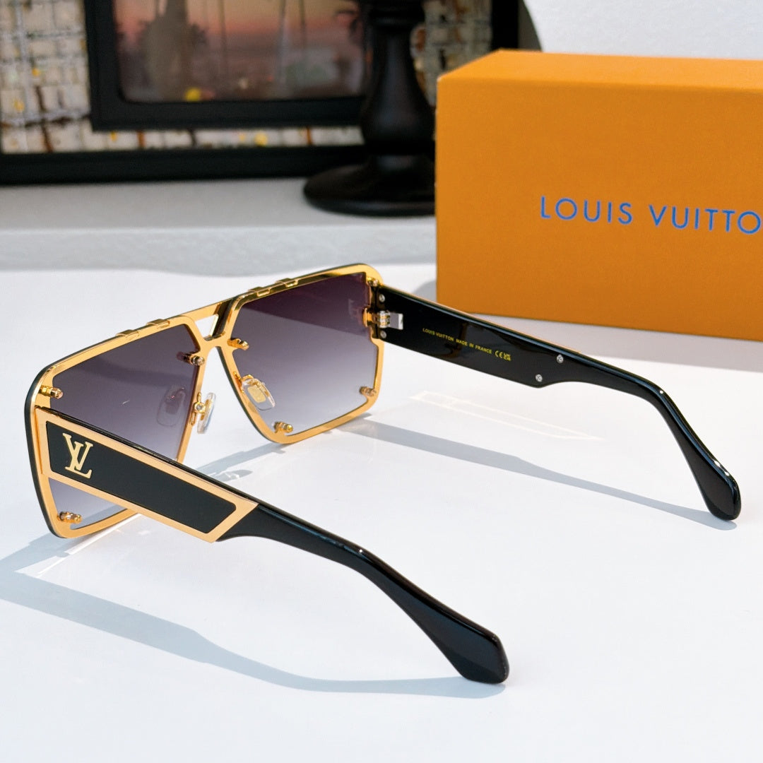 Gold-trimmed sunglasses with black frames and dark lenses, side profile