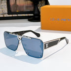 Silver-tone sunglasses with blue tinted lenses and angular logo frame