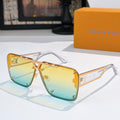 Gold-tone sunglasses with teal gradient lenses and angular side logo