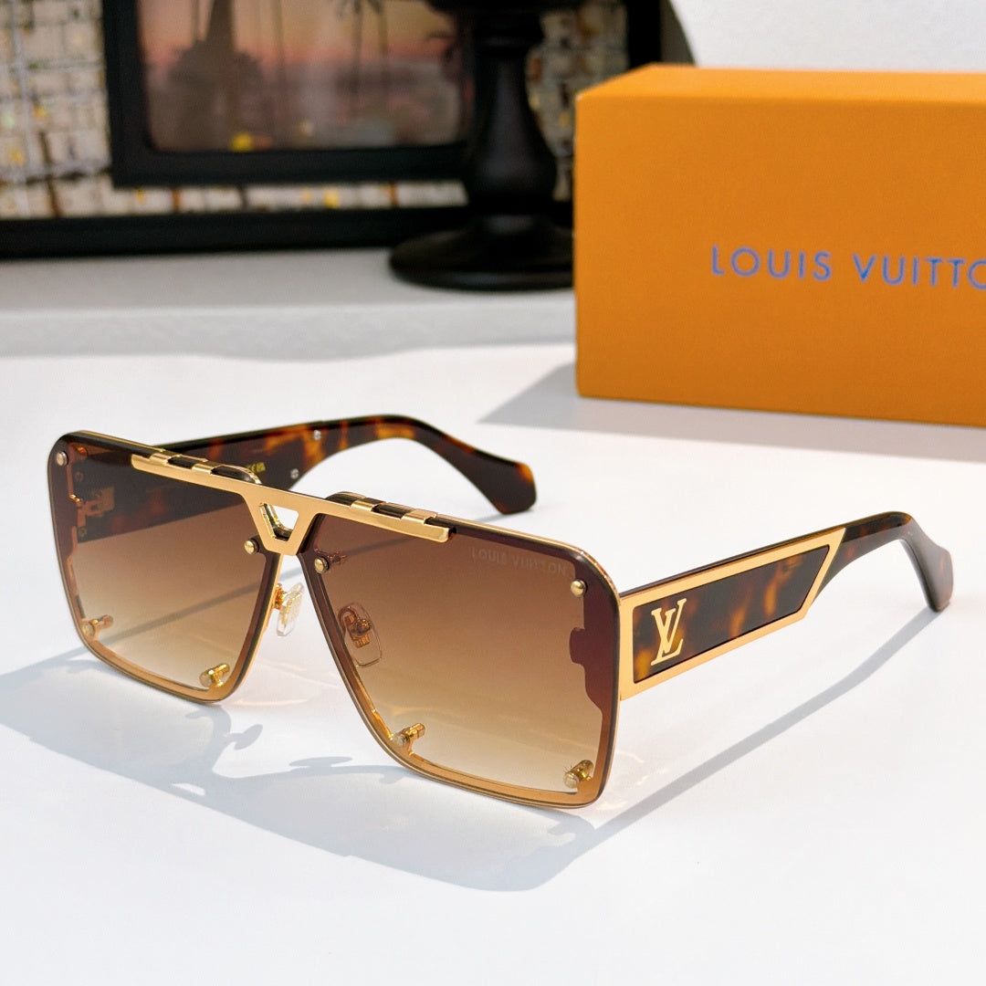 Gold-tone sunglasses with amber gradient lenses and angular logo detail