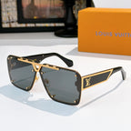 Black sunglasses with gold-tone angular frames and dark tinted lenses