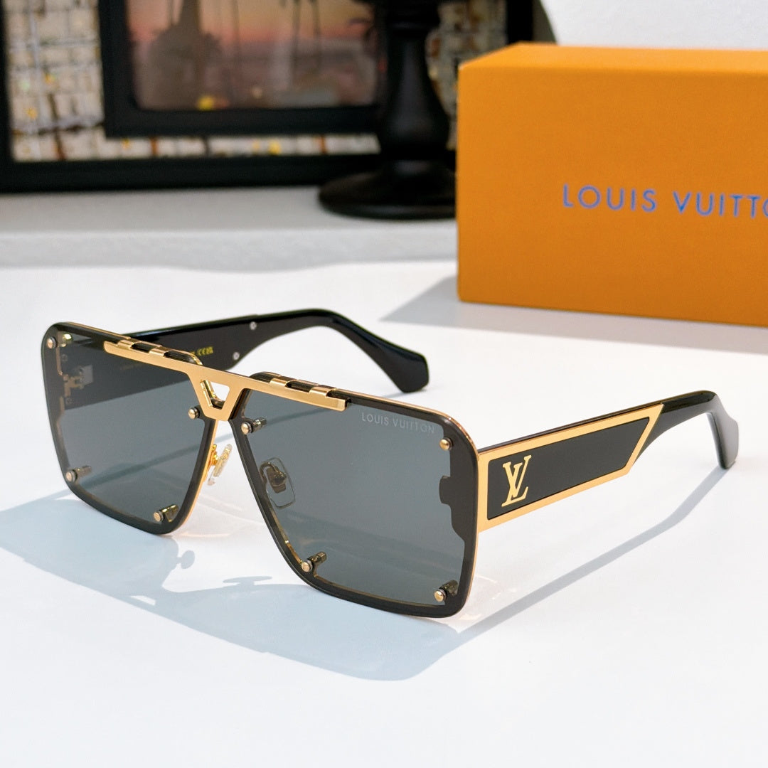 Black sunglasses with gold-tone angular frames and dark tinted lenses
