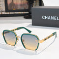 Green and gold sunglasses with tinted lenses and gold chain-style temples.