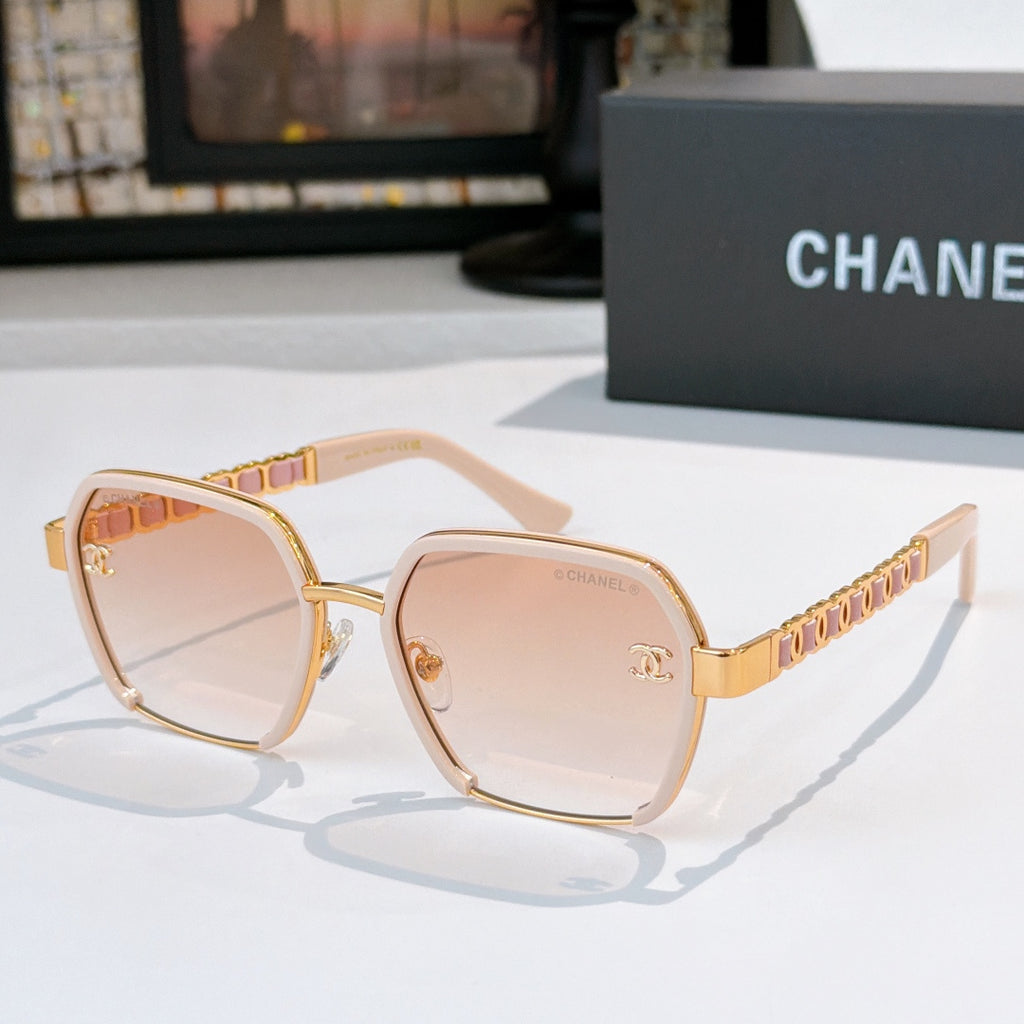 Light pink sunglasses with tinted lenses and gold chain-style temples.