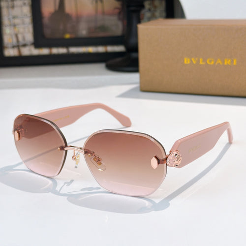 Rose-gold cat-eye sunglasses with pink lenses and gold detailing at the temple.