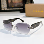 Black sunglasses with lavender lenses and gold emblem on the temple.