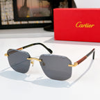Cartier glasses with dark frame and slate-blue lenses, gold-tone bridge hardware