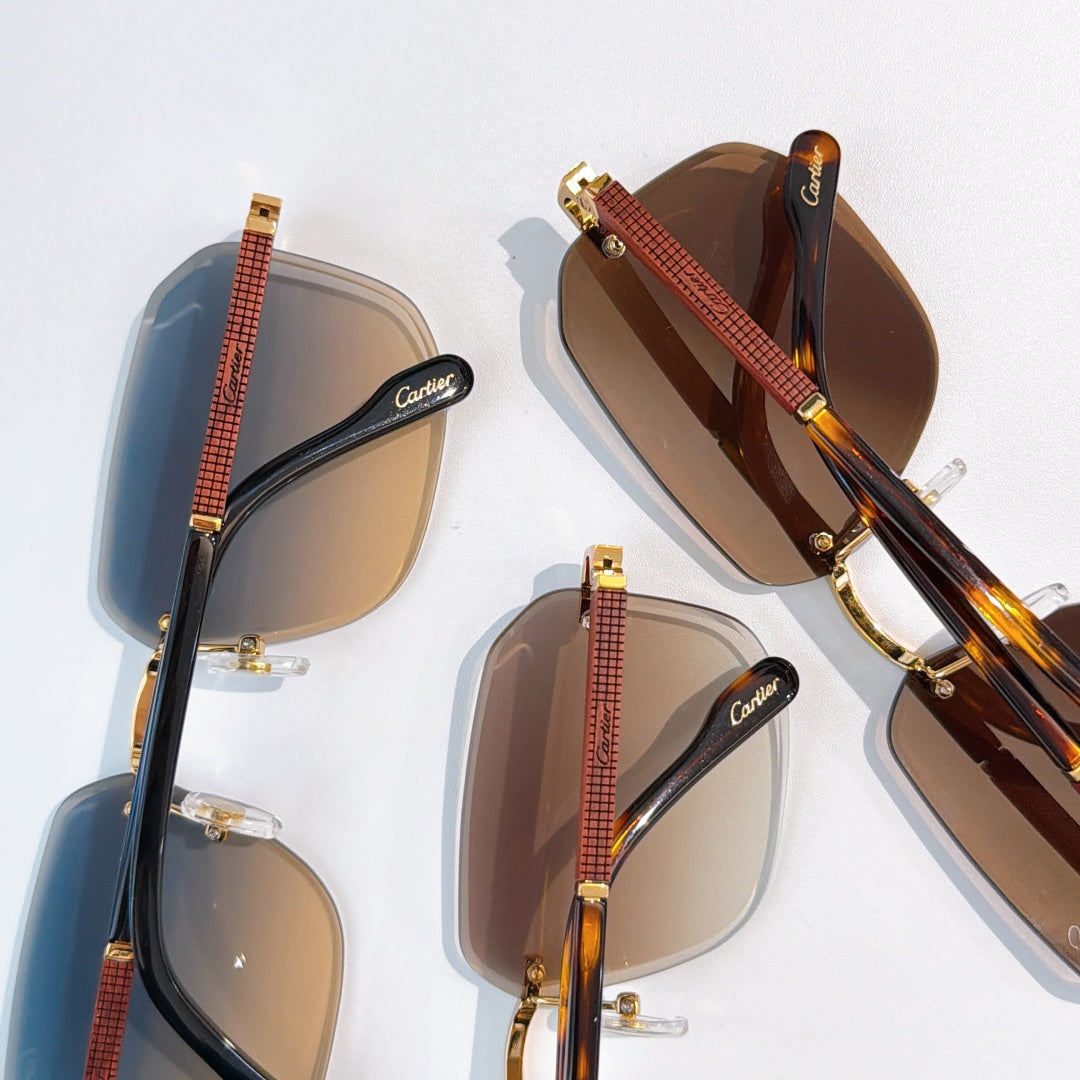 Cartier glasses set with mixed frames and tinted lenses, gold-tone hinges and accents