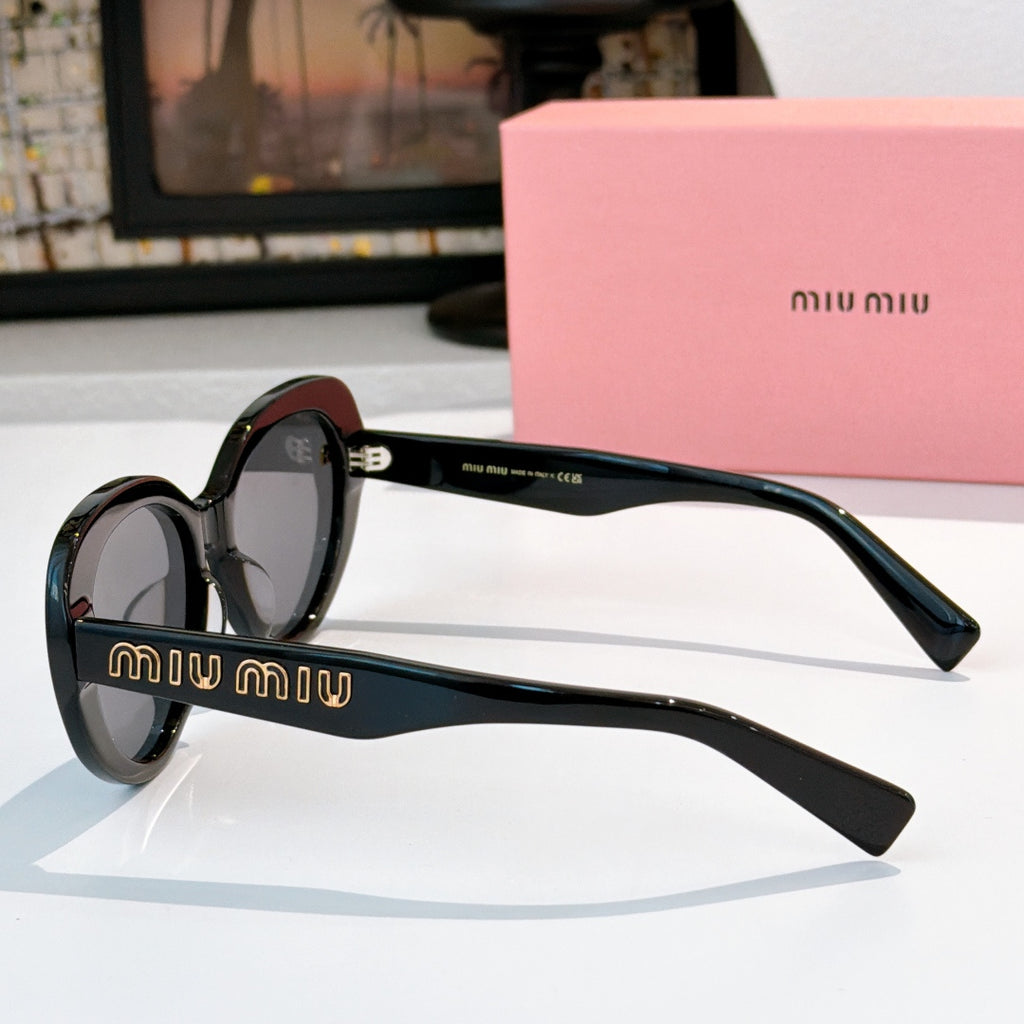 MiuMiu round sunglasses, side view, dark frames with gold logo arms