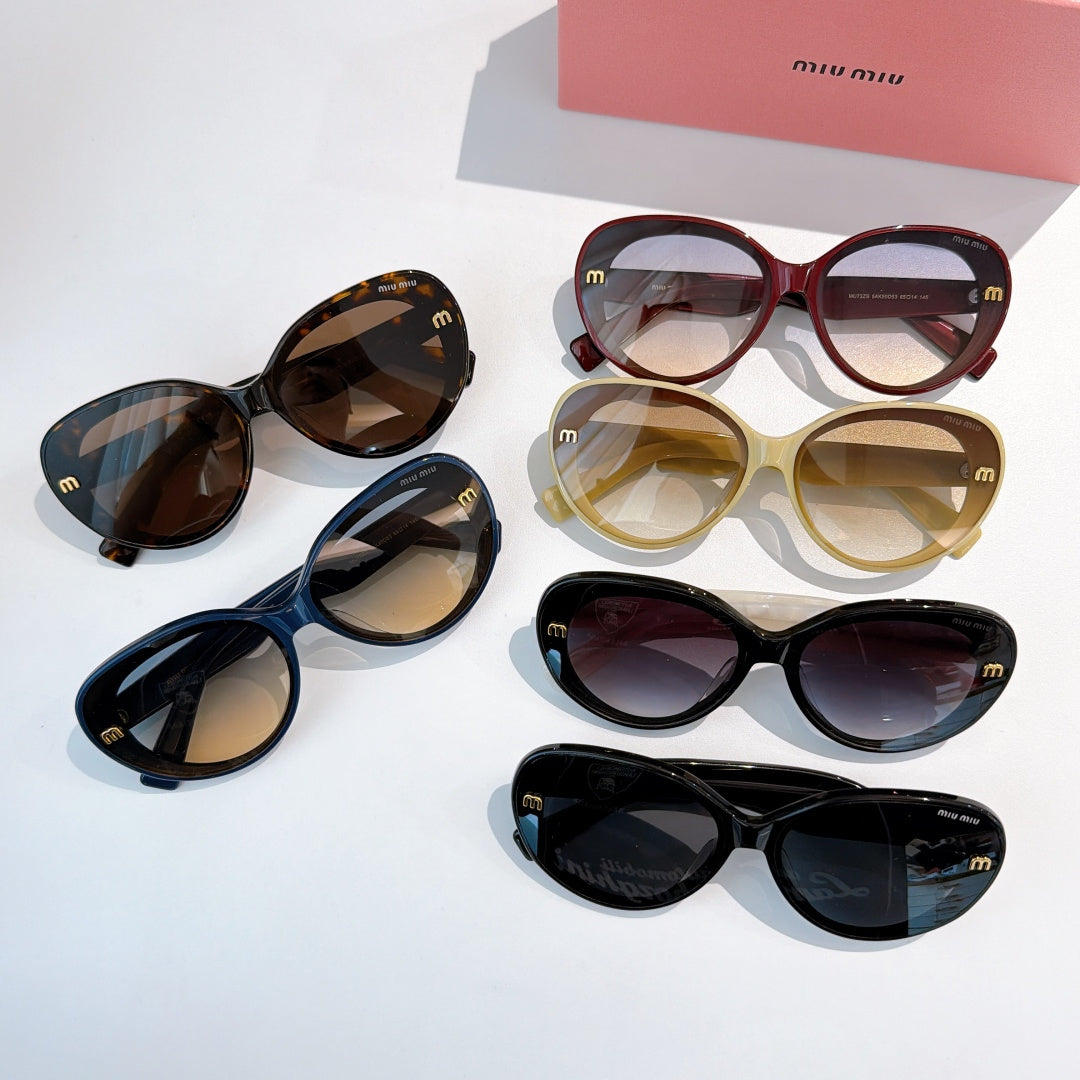 MiuMiu sunglasses assortment on display, mixed tortoiseshell, tan, blue, and black frames