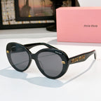 MiuMiu round sunglasses, glossy black frames, dark lenses with gold logo