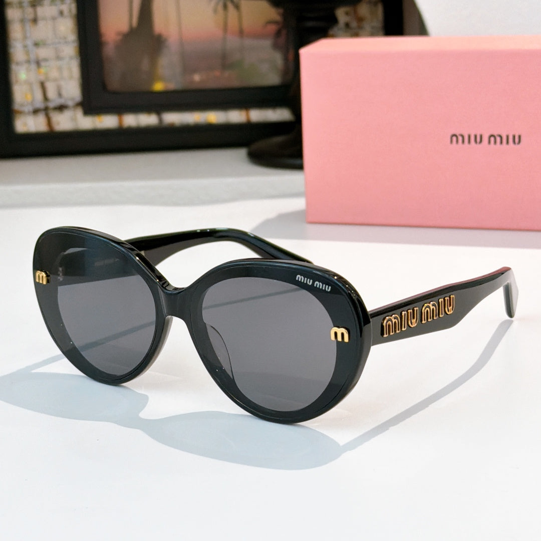 MiuMiu round sunglasses, glossy black frames, dark lenses with gold logo