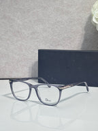 Dior eyeglasses with dark blue rectangular frames and clear lenses