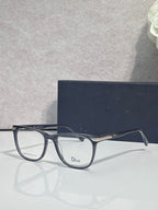 Dior eyeglasses with dark blue rectangular frames and gold-toned temple hardware