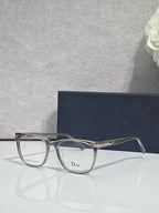 Dior eyeglasses with silver-toned frames and clear rectangular lenses