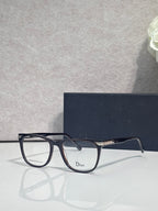 Dior eyeglasses with dark blue full-rim frames and clear rounded rectangle lenses