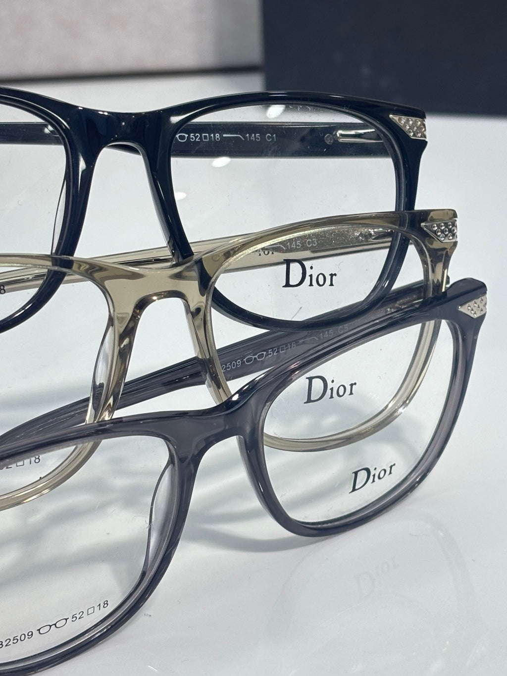 Dior eyeglasses close-up with logo temples and engraved size markings