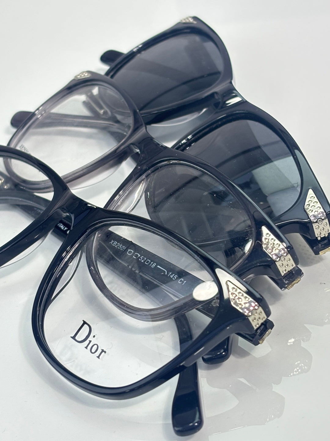 Dior sunglasses with dark blue frames and layered tinted lenses, top view