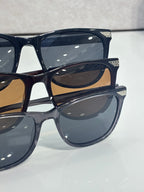 Set of Dior eyeglass frames in dark blue with tinted lenses, stacked close-up