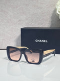 Chanel glasses with dark blue acetate frames and gold-tone temple tips, square lenses