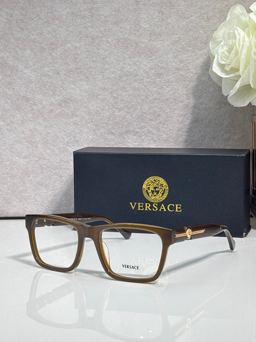 Versace eyeglasses, brown acetate frame with clear lenses and gold temple emblem