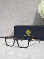 Versace eyeglasses, amber tortoiseshell acetate frame with clear lenses and gold logo