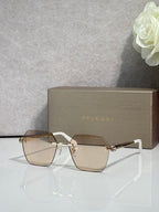 Square clear-beige sunglasses with gold frame and gold hinge details