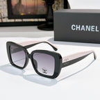 Chanel sunglasses with dark frame, light beige arms, gray tinted lenses