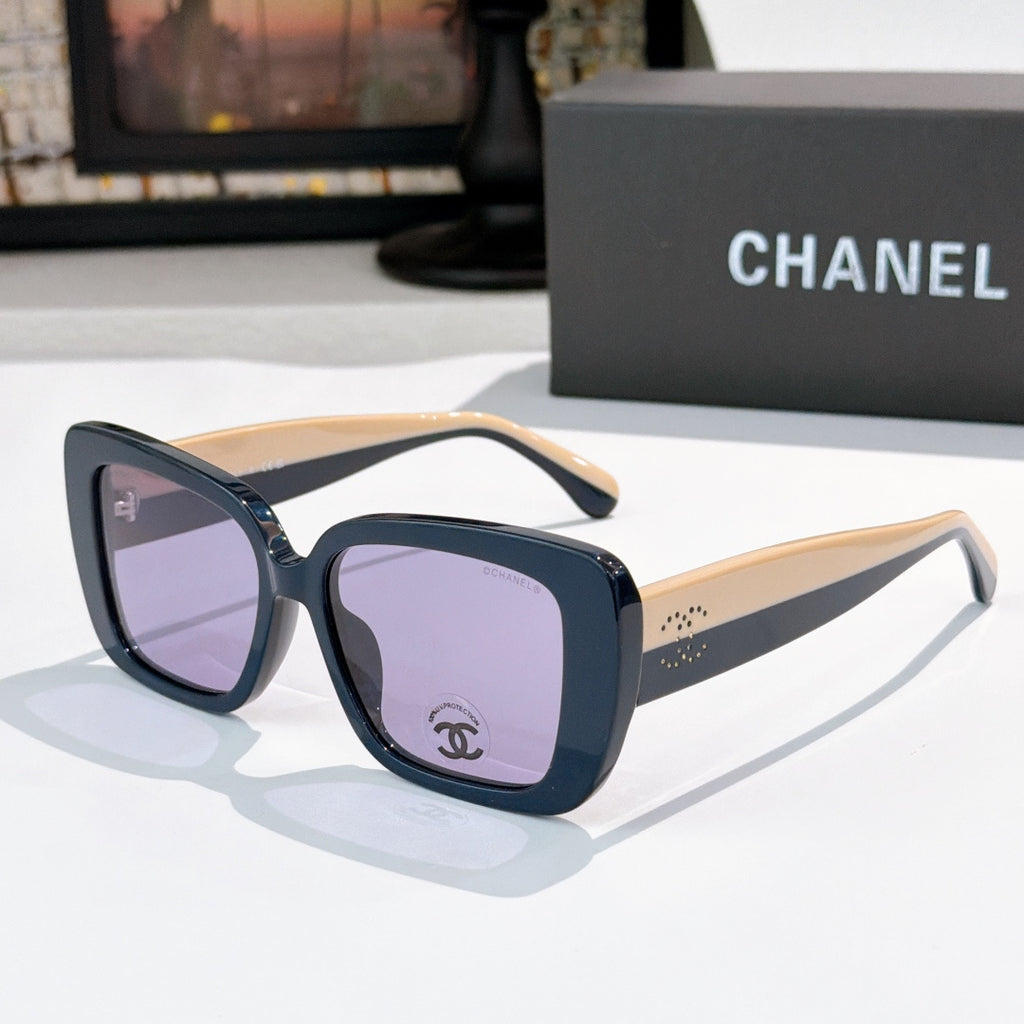 Chanel sunglasses with dark blue frame, light beige arms, purple tinted lenses