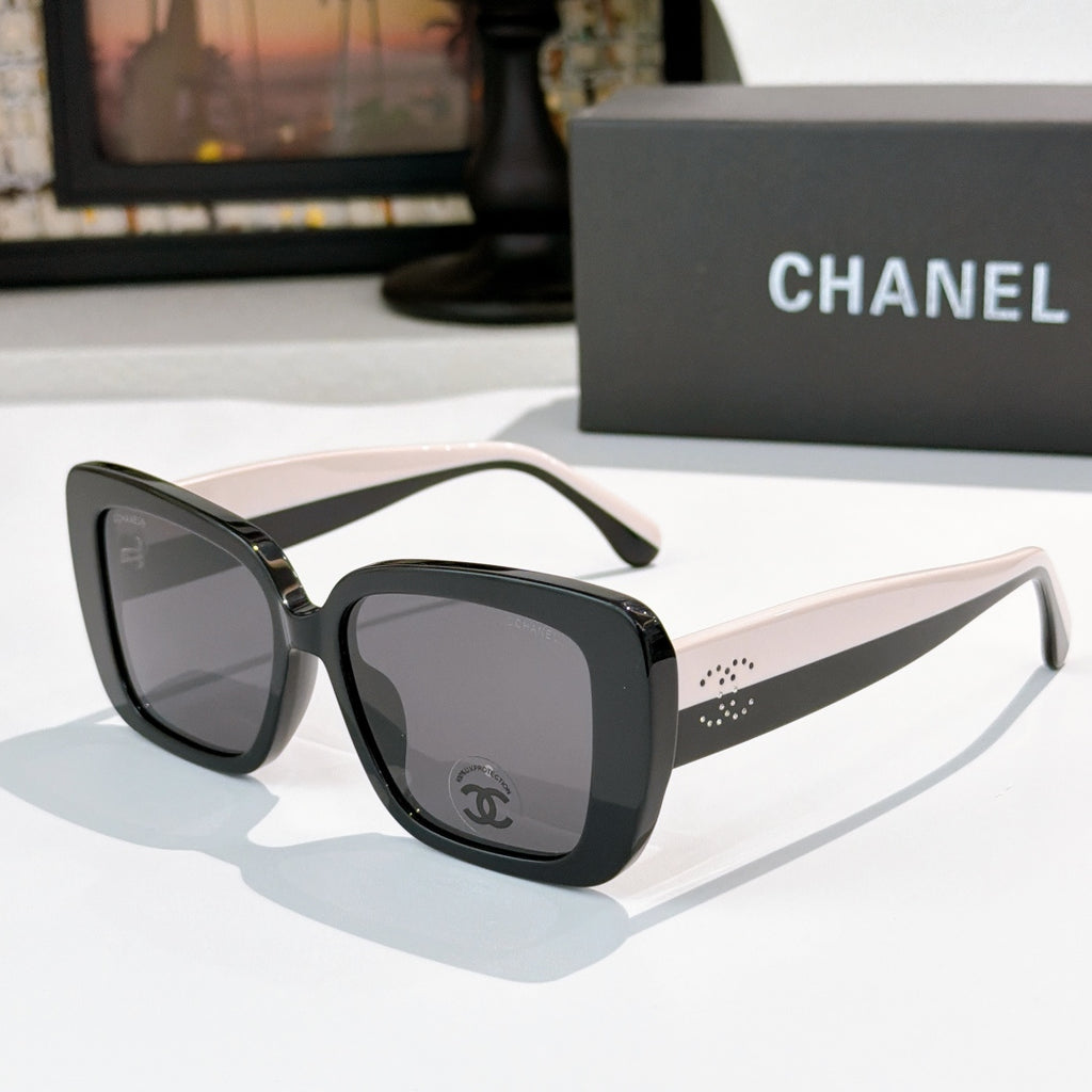 Chanel sunglasses with dark frame, white-beige arms, gray tinted lenses
