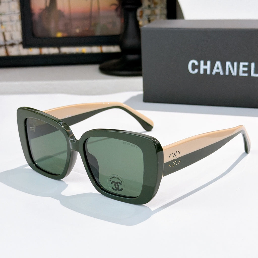Chanel sunglasses with dark green frame, light beige arms, green tinted lenses