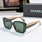Chanel sunglasses with dark green frame, light beige arms, green tinted lenses