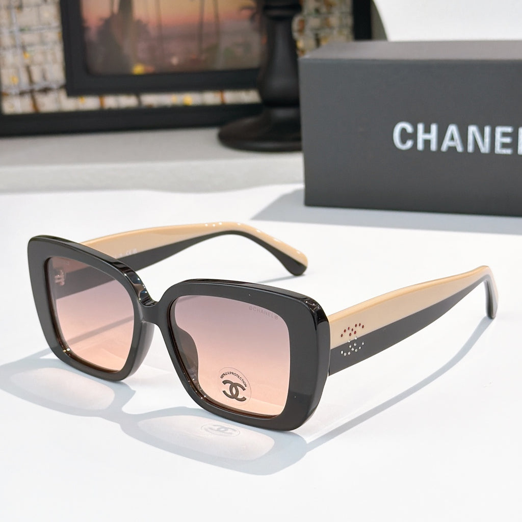 Chanel sunglasses with dark frame, light beige arms, pink tinted lenses