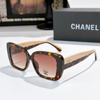 Chanel sunglasses with tortoiseshell frame, light beige arms, amber tinted lenses