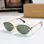 Gold oval sunglasses with green lenses, tortoise temple tips, jeweled bridge