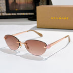 Rose-gold oval sunglasses with pink lenses, tortoise temple tips, jeweled bridge