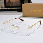 Gold oval eyeglasses with clear lenses, tortoise temple tips, jeweled bridge