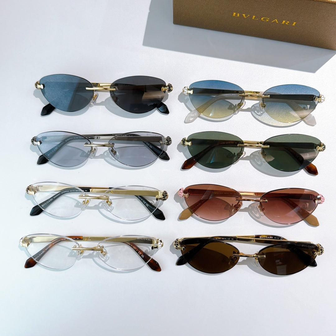 Assorted oval sunglasses with gold frames and mixed tinted lenses