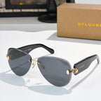 Bvlgari sunglasses with dark blue lenses, black frame, and gold accents.