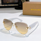 Bvlgari sunglasses with light tan lenses, gold-tone frame, and gold accents.