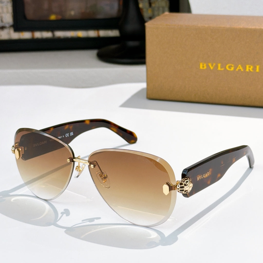 Bvlgari sunglasses with brown gradient lenses, tortoiseshell frame, and gold accents.