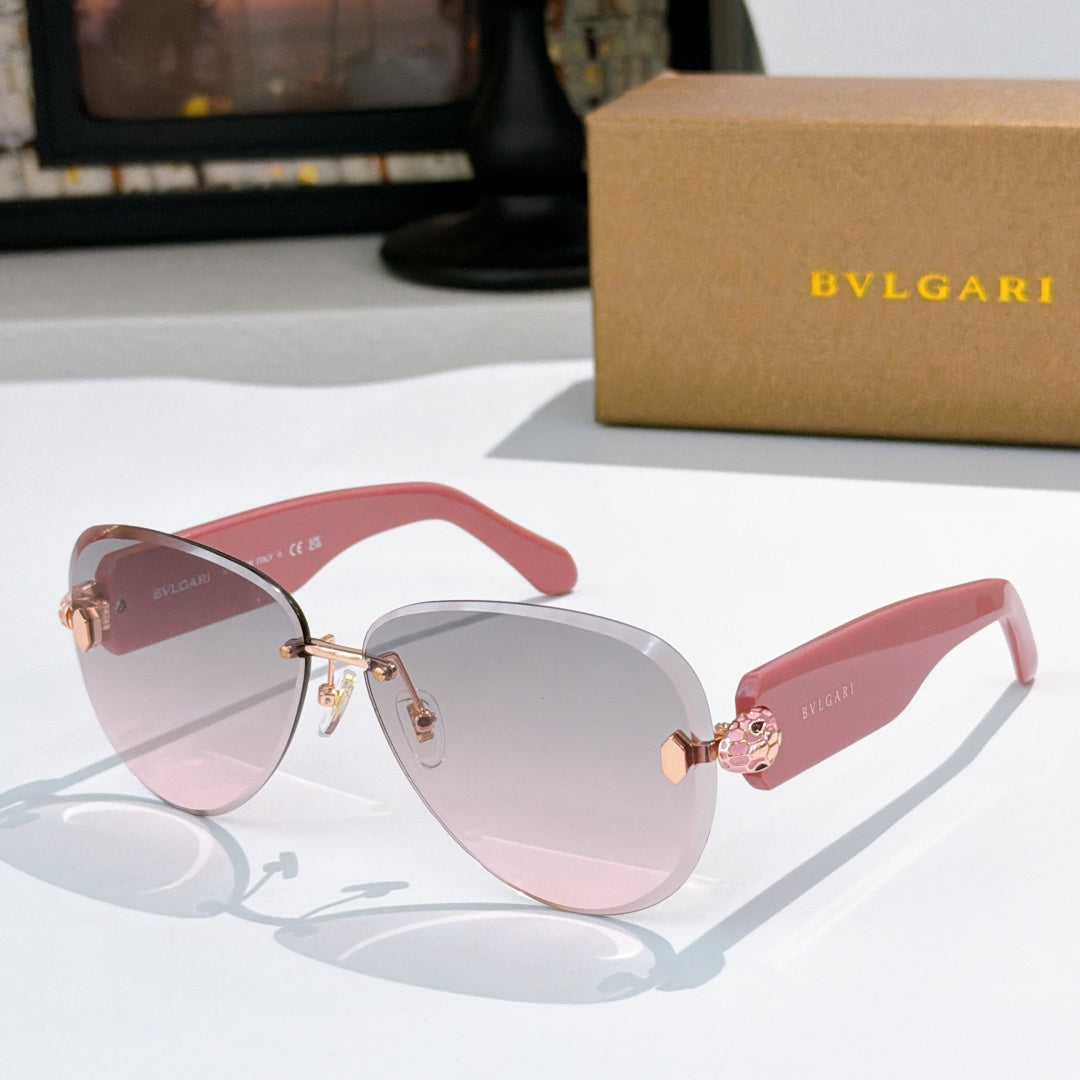 Bvlgari sunglasses with pink gradient lenses, pink frame, and gold details.